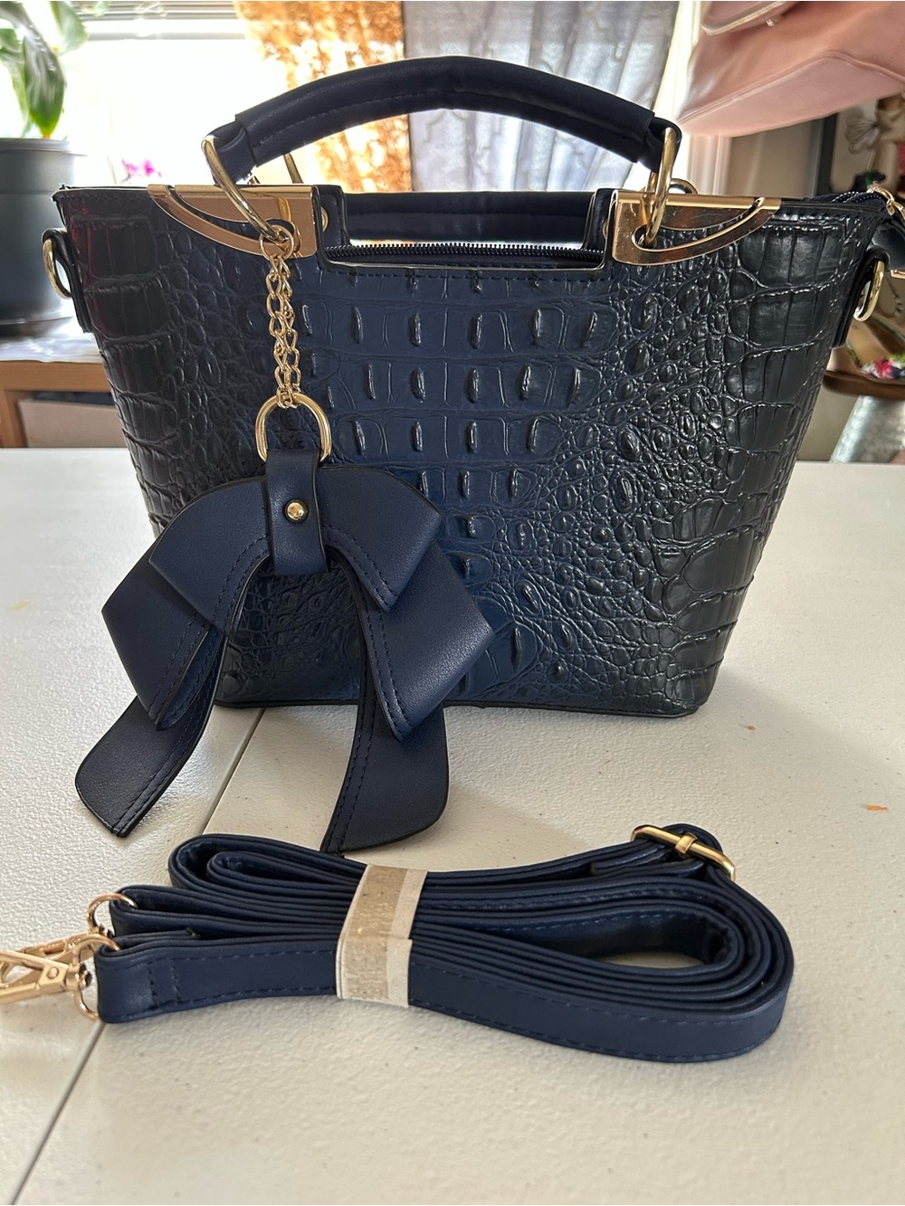 Croc-Embossed Navy Satchel with Bow Charm and Gold Accents